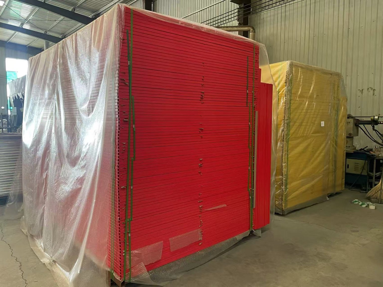Organized stacks of temporary fencing ready for shipment